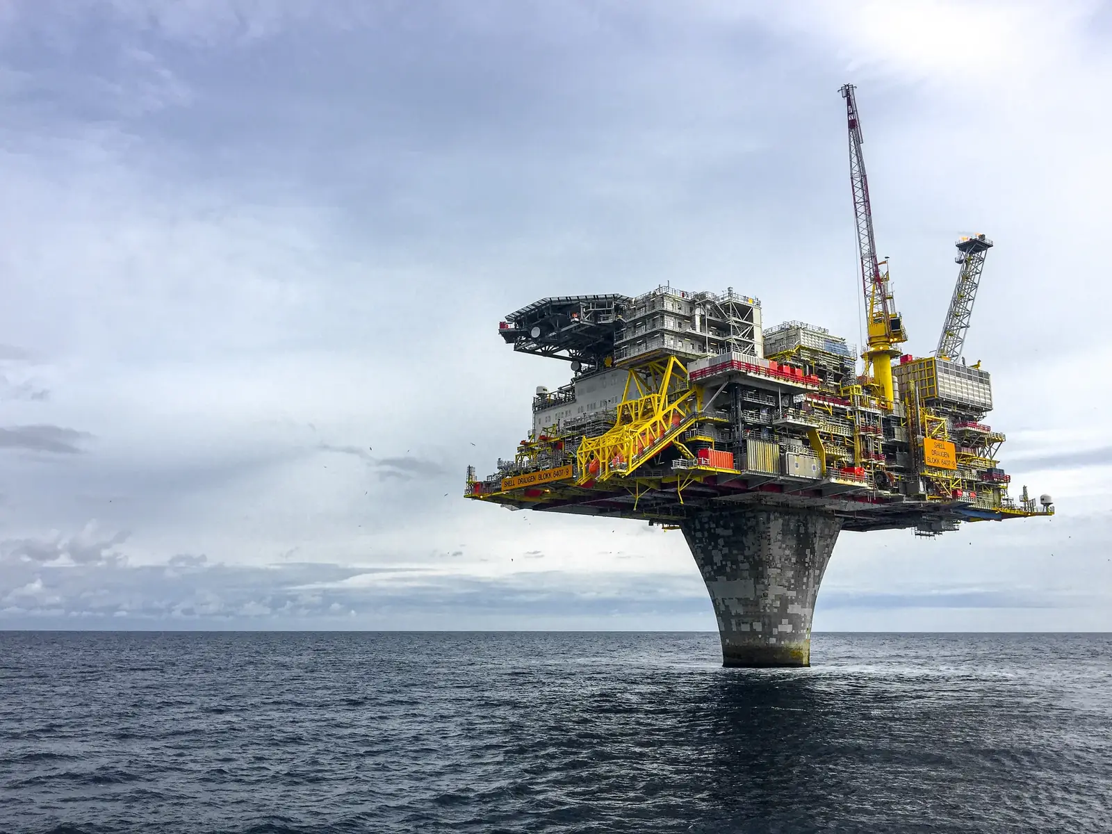 An offshore oil and gas production platform at sea.
