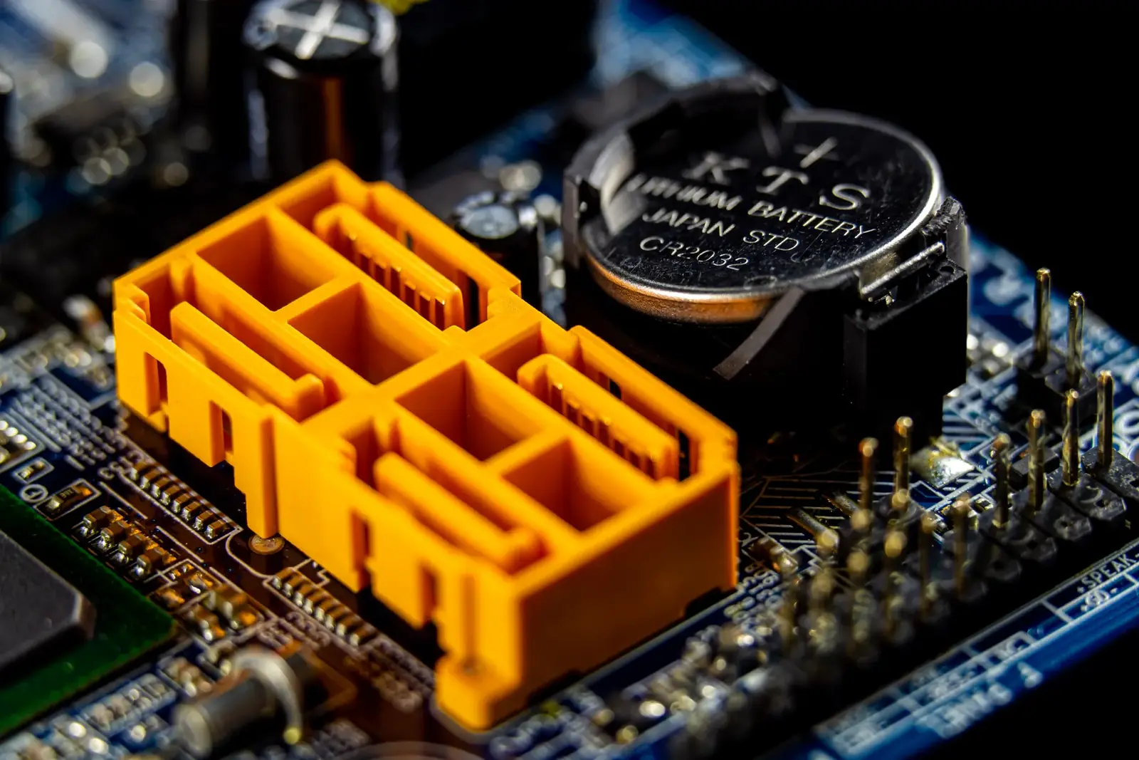 Close-up view of a motherboard with visible electronic components and connectors.