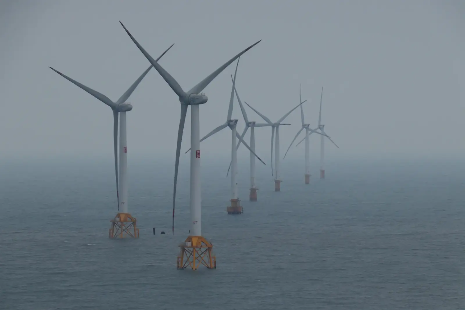 Offshore wind turbines generating clean energy in the ocean breeze.